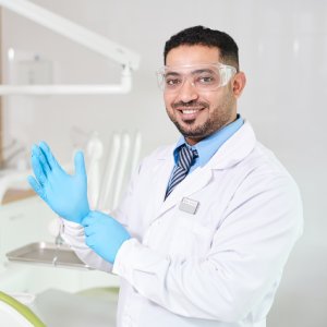 Friendly implant dentist in Los Gatos preparing for treatment in a modern dental office
